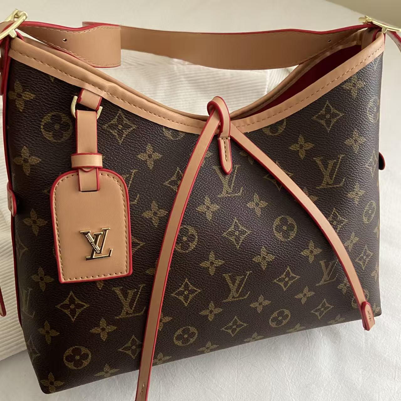 Monogram skulderveske med kryssrem