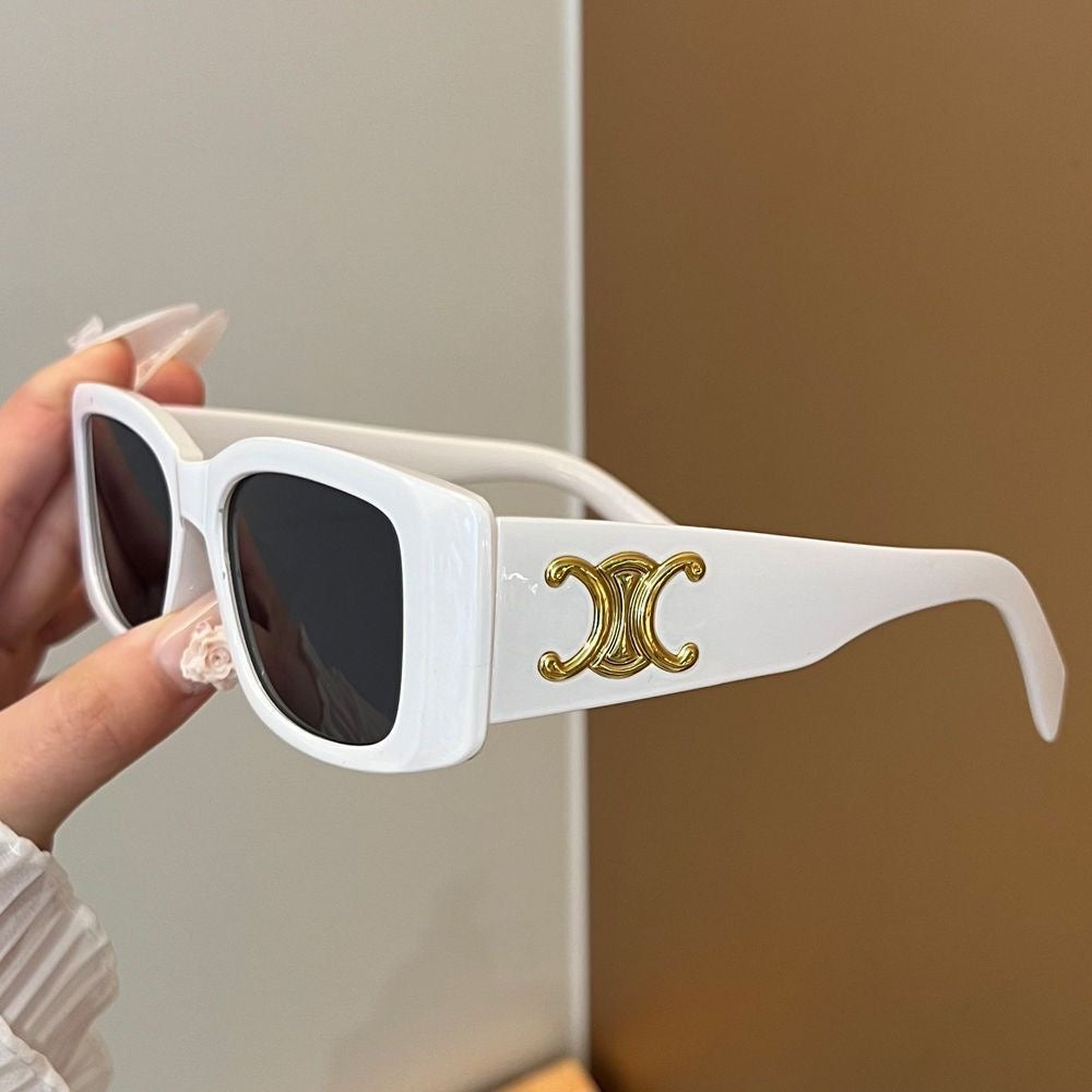 Luxe retro zonnebril met gouden plaquette
