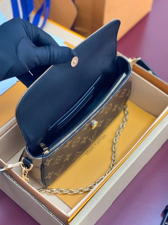 Ylellinen klassinen monogrammiolkalaukku