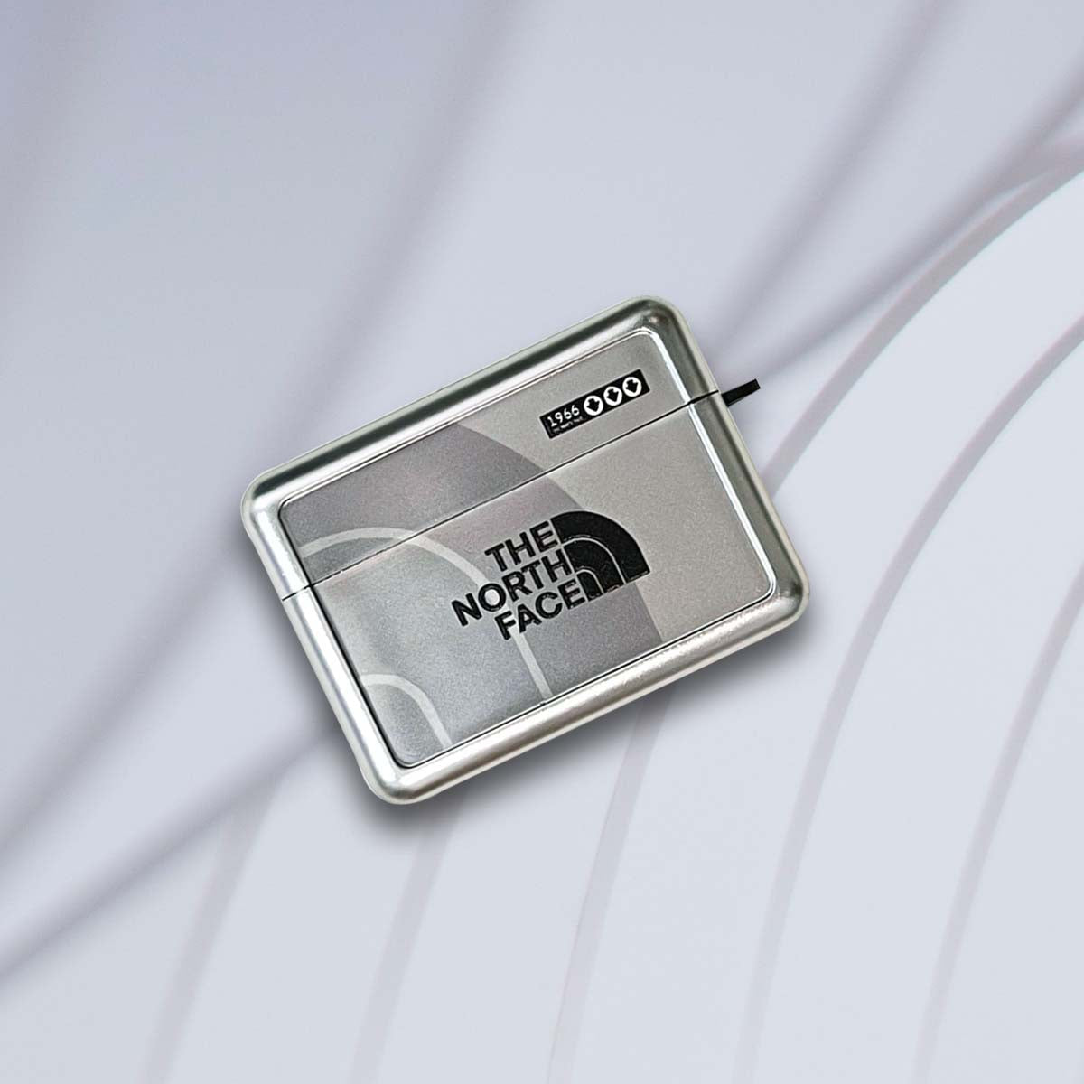 Heijastava AirPods-kotelo | TNF hopea